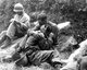 Korea: An American infantryman comforts another whose friend has just been killed. Haktong-ni, Korea, August 28, 1950